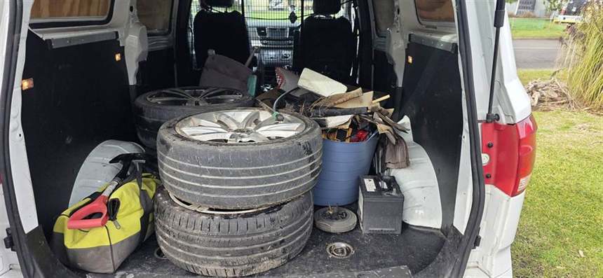 Van loaded with tyres, rims and hard rubbish